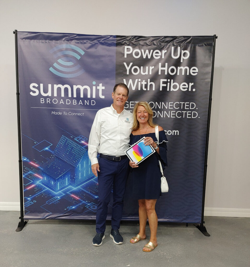 Summit Broadband holiday contest winner with her prize (iPad).