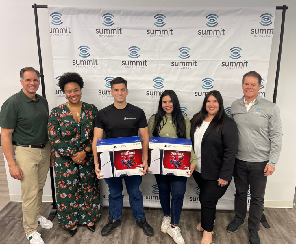 Summit Broadband holiday contest winners with their prizes (PlayStation 5s).